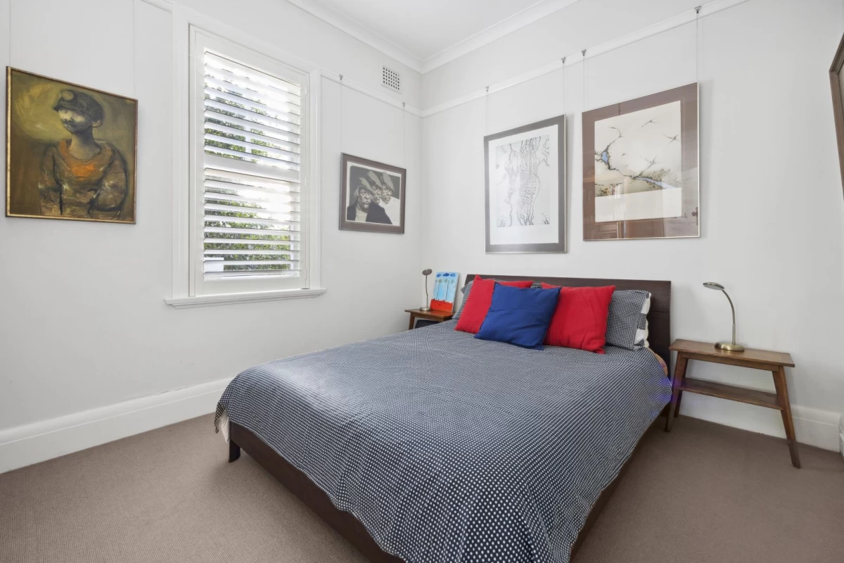 A cosy bedroom with a large window and space for a bed - 1/7 Lang Street, Mosman NSW 2088