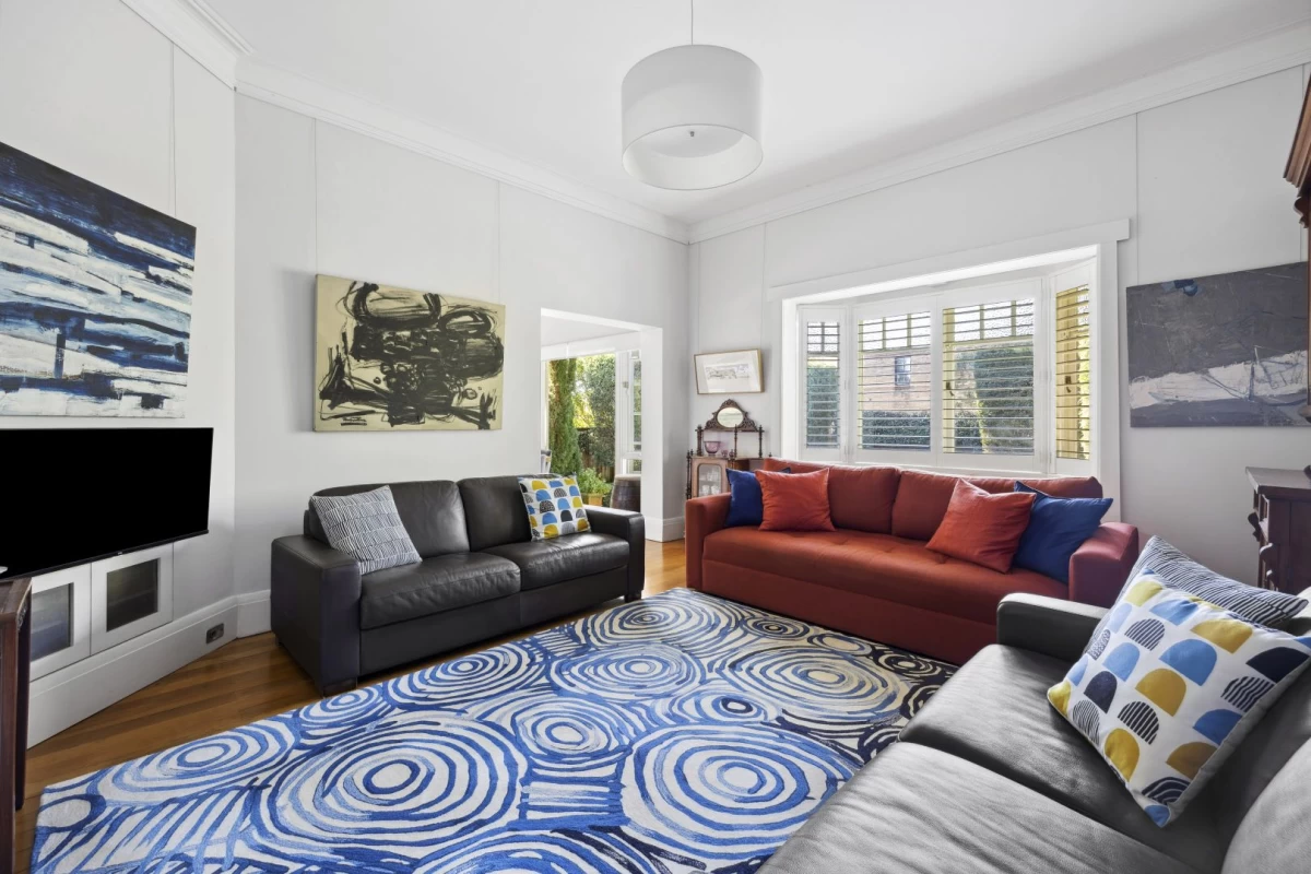 Spacious living room with a big window and space for sofas - 1/7 Lang Street, Mosman NSW 2088