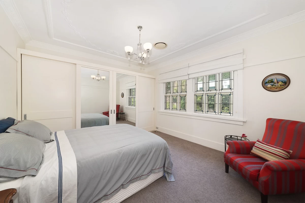 Sunny bedroom with a bed, chair, and mirrored closet - 10/20 Musgrave Street Mosman, NSW 2088