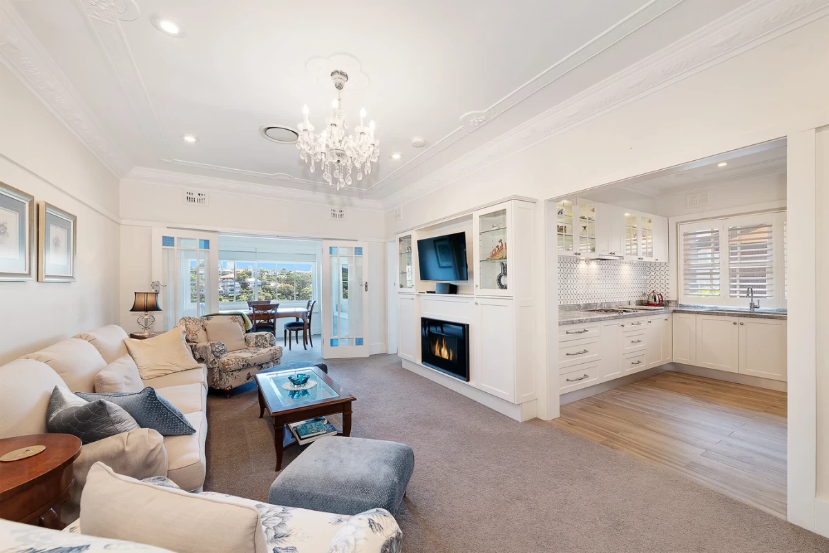 Spacious and bright living room with a fireplace and TV setup - 10/20 Musgrave Street Mosman, NSW 2088