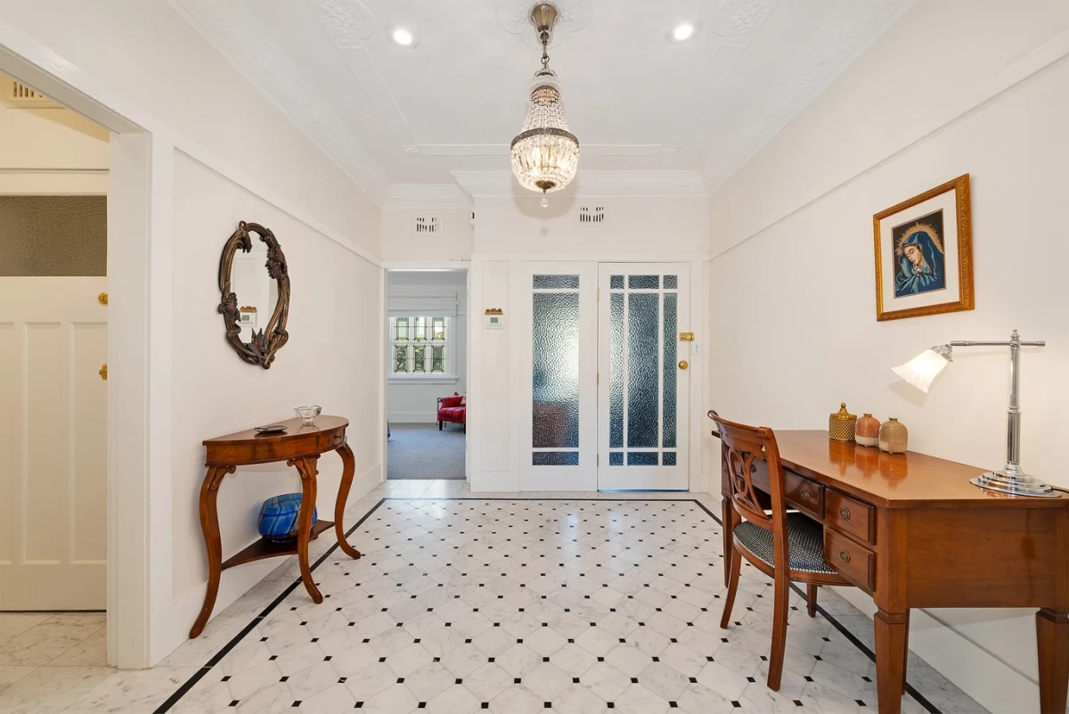 Bright entry hallway with a desk and decorative tables - 10/20 Musgrave Street Mosman, NSW 2088