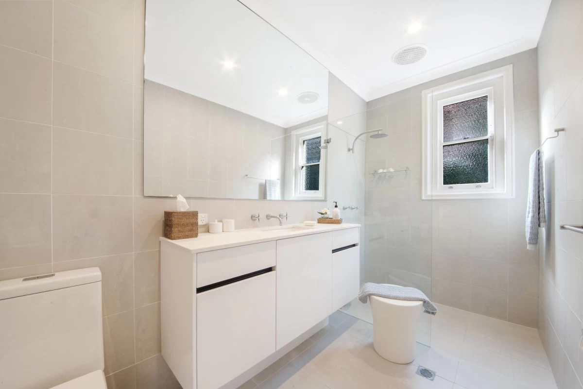 Bright bathroom with a double sink and large mirror, very practical. - 127 Avenue Road, Mosman, NSW 2088