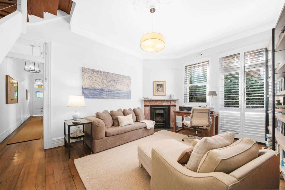 Comfortable and bright living room with a fireplace and desk space. - 127 Avenue Road, Mosman, NSW 2088