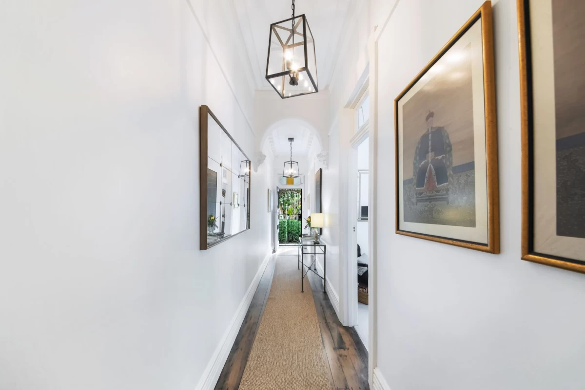 Long and bright hallway with cool lights and space for artwork. - 127 Avenue Road, Mosman, NSW 2088