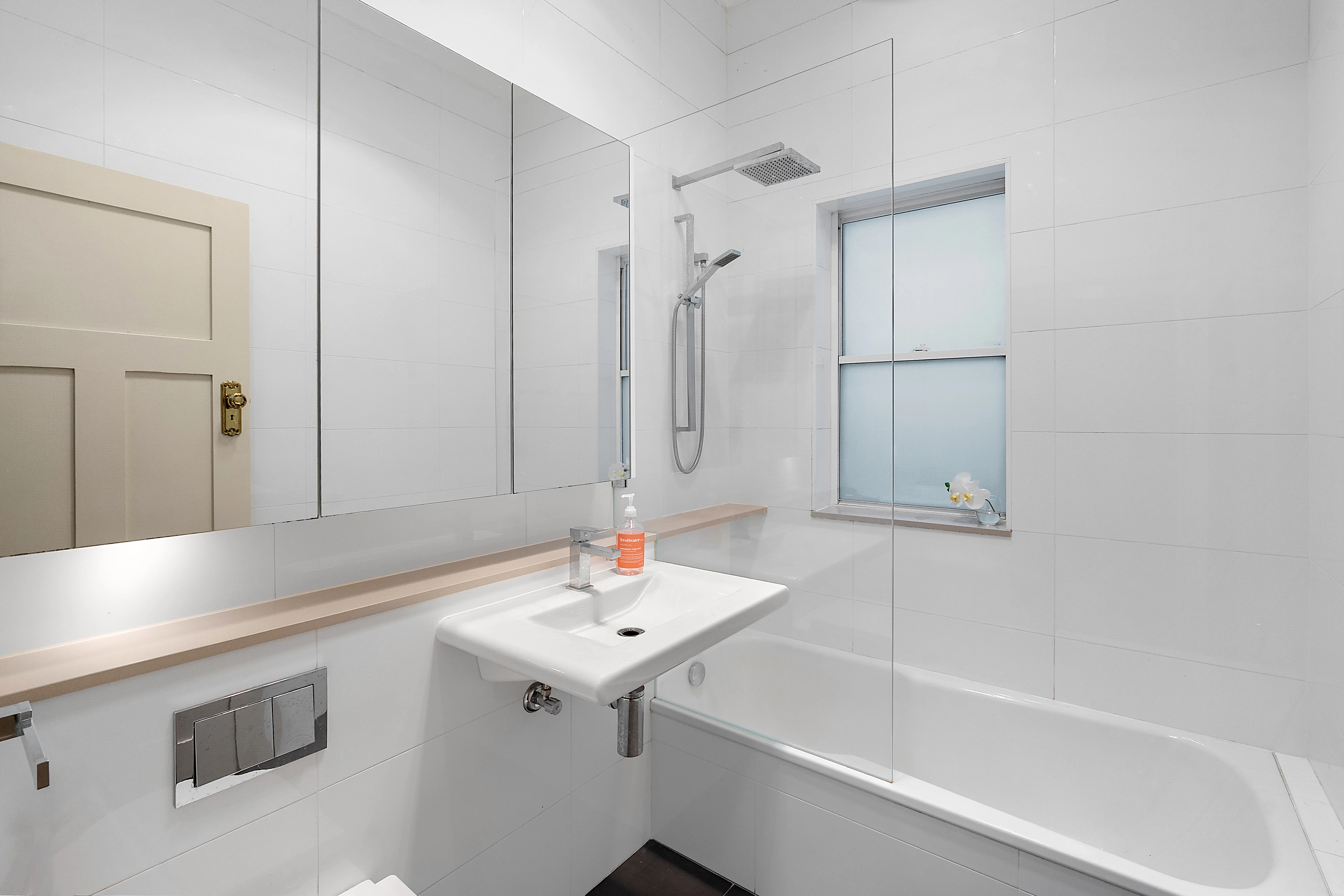 Modern bathroom with white tiles, a shower, and a bathtub - 13 Allison Avenue, Lane Cove, NSW 2066