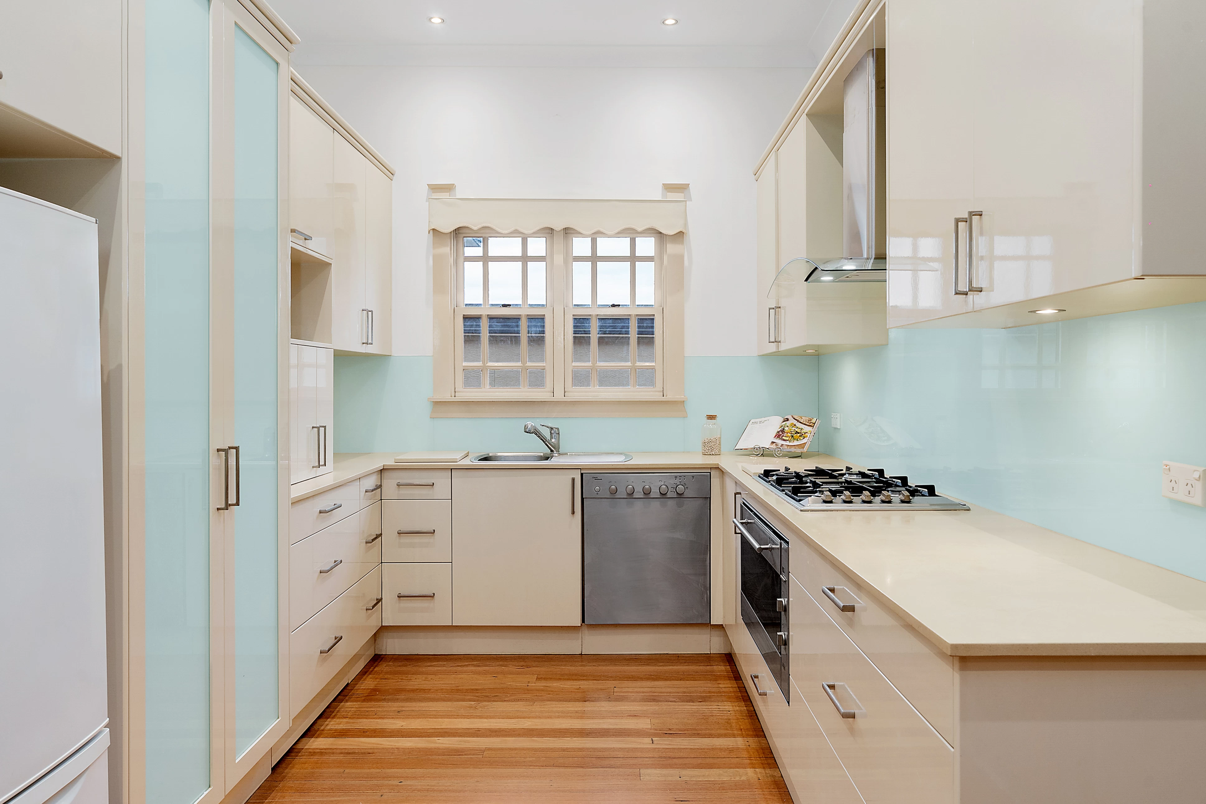 Practical kitchen with ample cabinets and a light blue splashback - 13 Allison Avenue, Lane Cove, NSW 2066