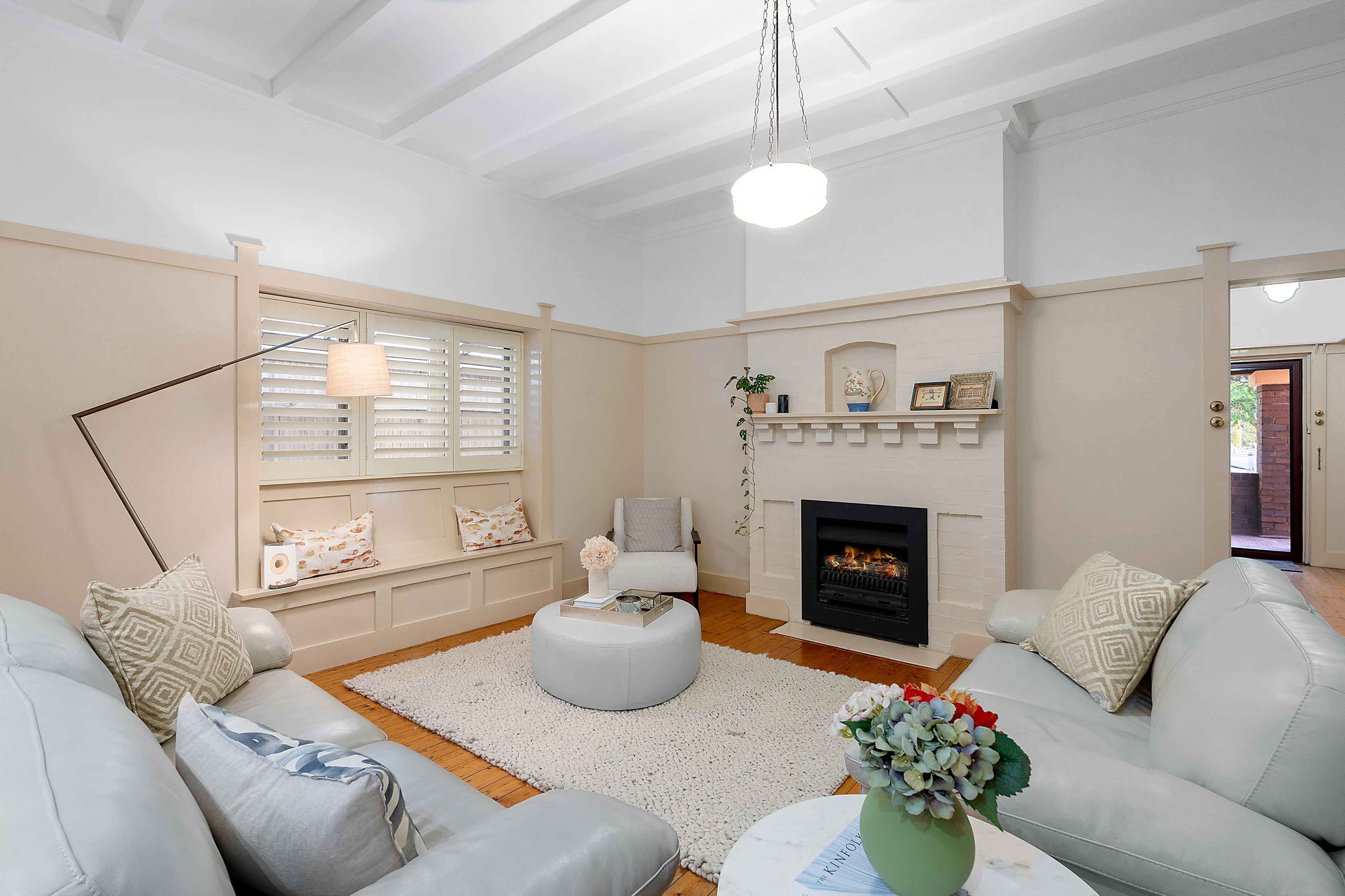 Comfortable living room with a big window and a fireplace - 13 Allison Avenue, Lane Cove, NSW 2066