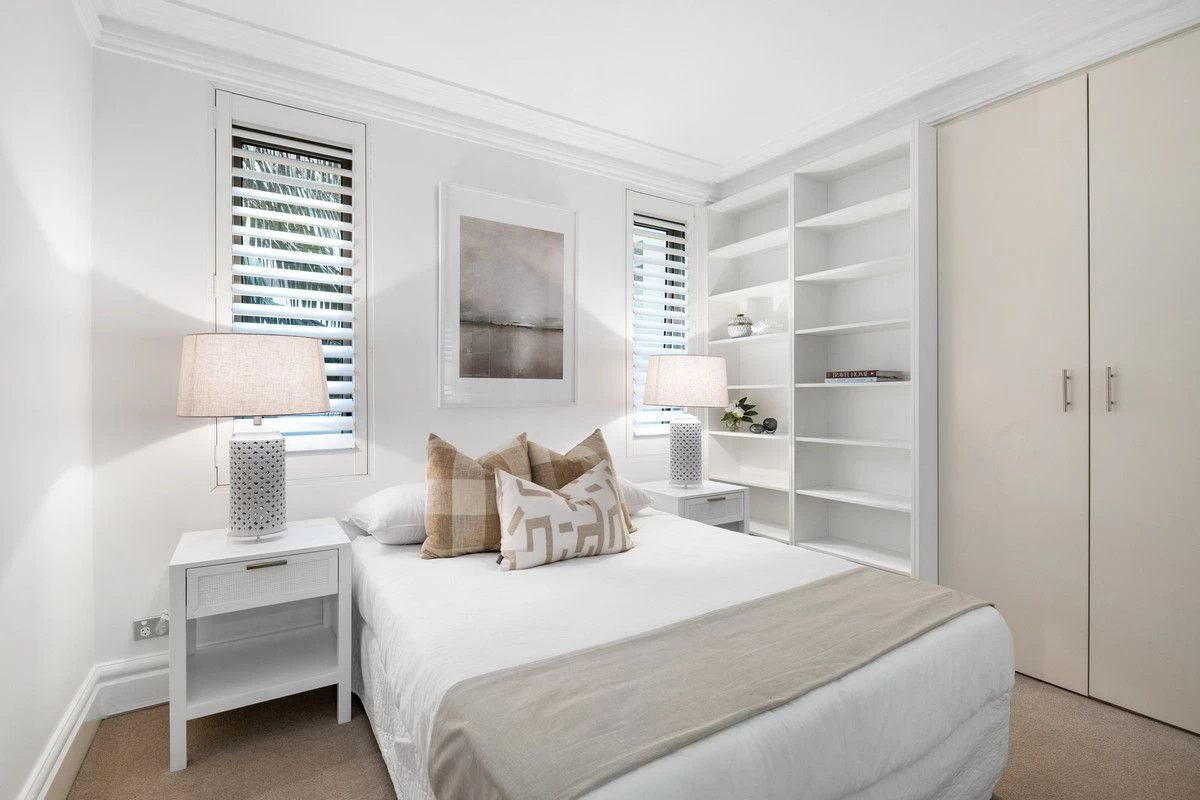 A bedroom with built-in shelves, a bed, and lots of natural light - 18/1A Bond Street, Mosman, NSW 2088