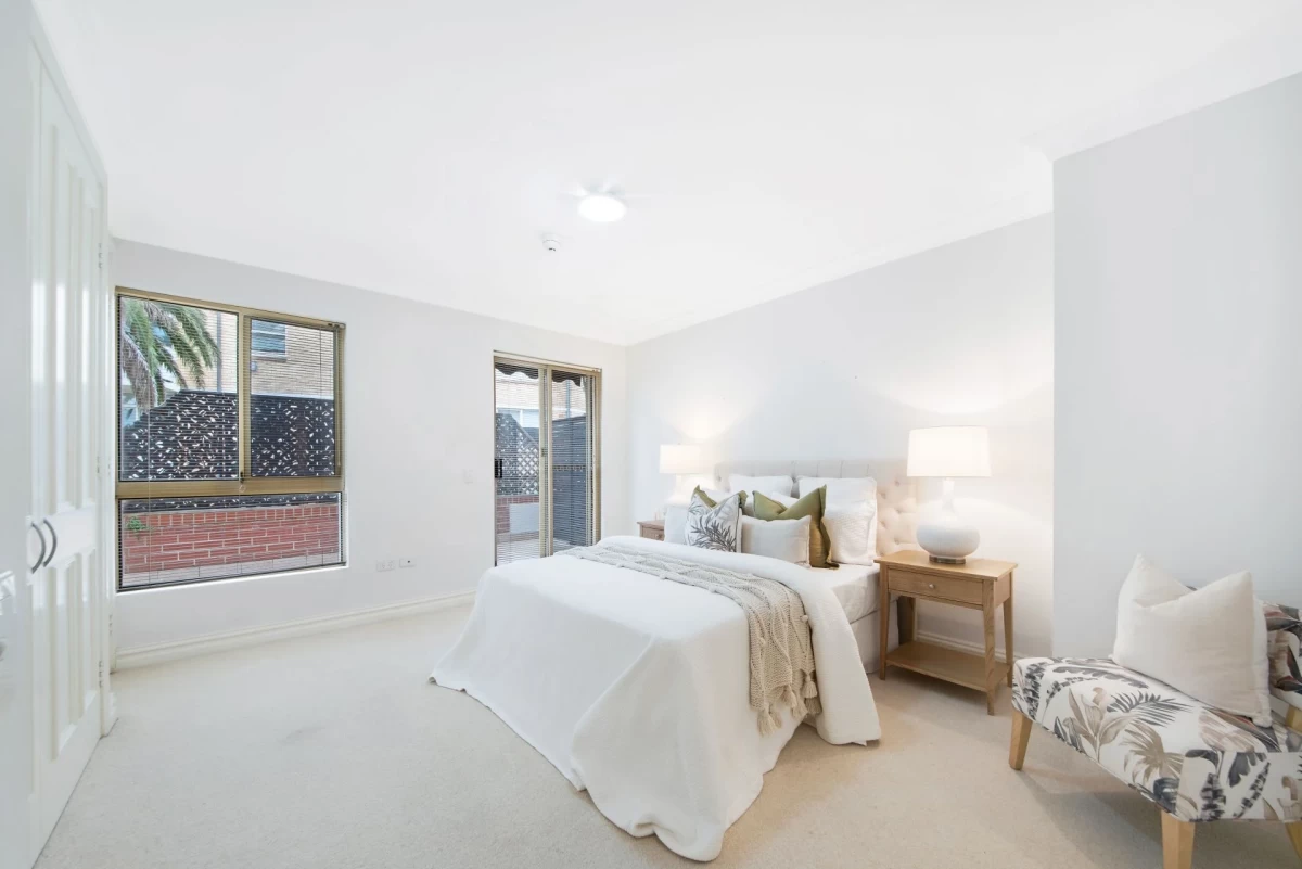 Spacious main bedroom with large windows and access to a private balcony - 18/69 Bradleys Head Road, Mosman, NSW 2088