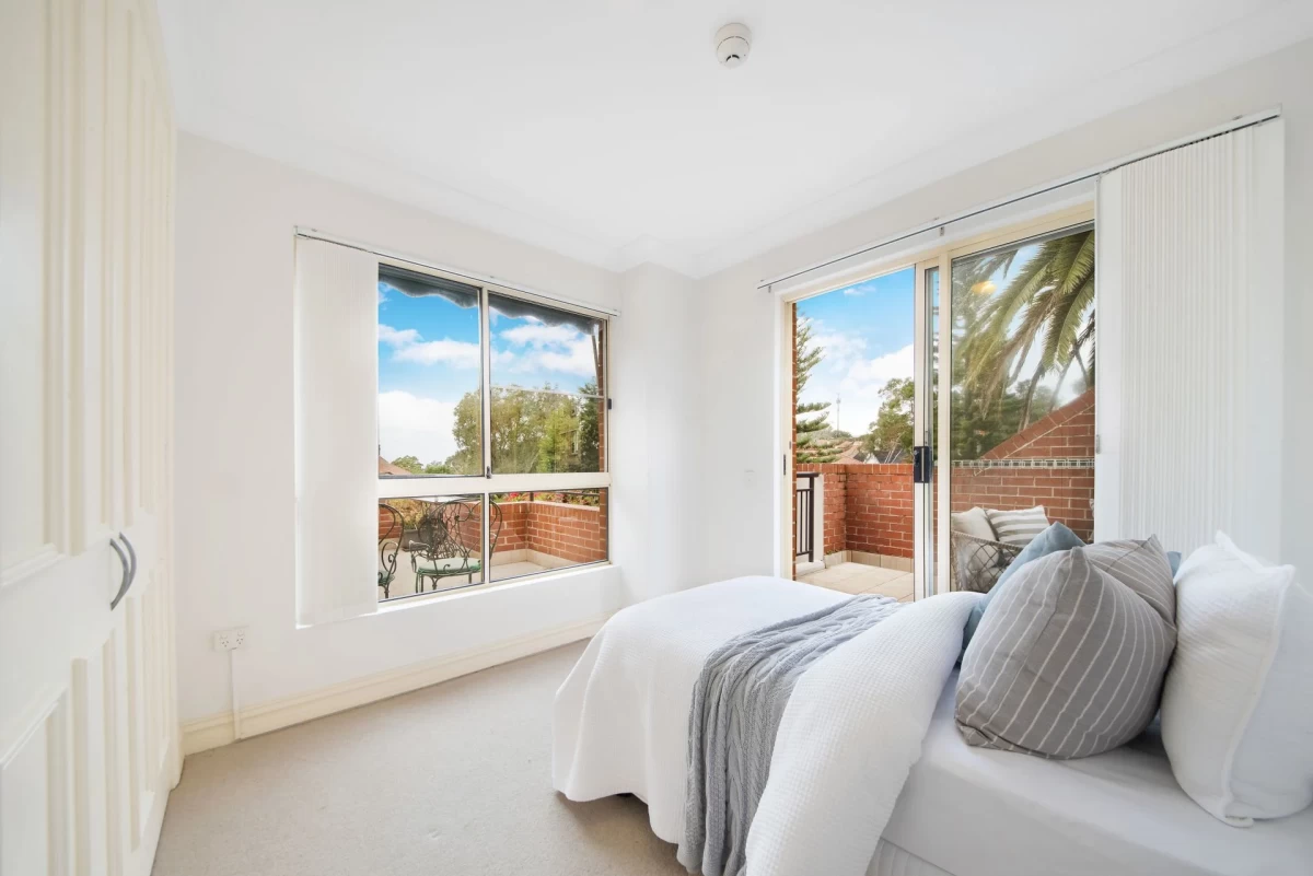 Bright secondary bedroom with large windows and access to a balcony - 18/69 Bradleys Head Road, Mosman, NSW 2088