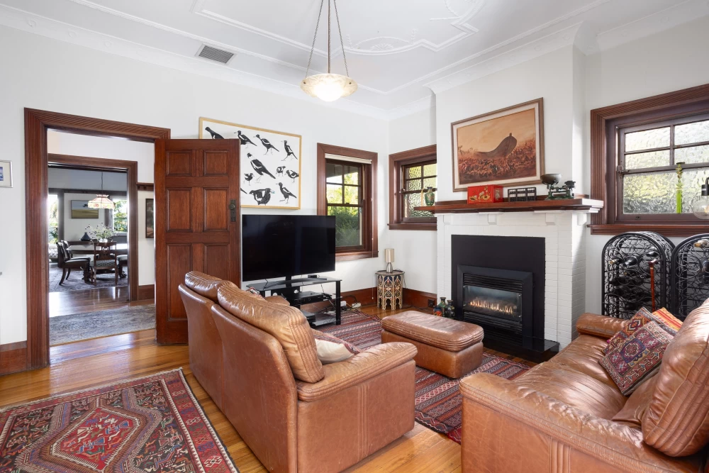 A cosy living room with a fireplace and TV - 215A Spit Road, Mosman, NSW 2088