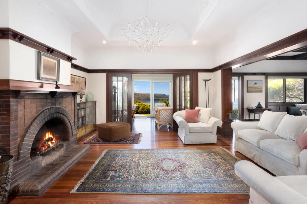 Spacious living room with a fireplace and access to outdoor views - 215A Spit Road, Mosman, NSW 2088