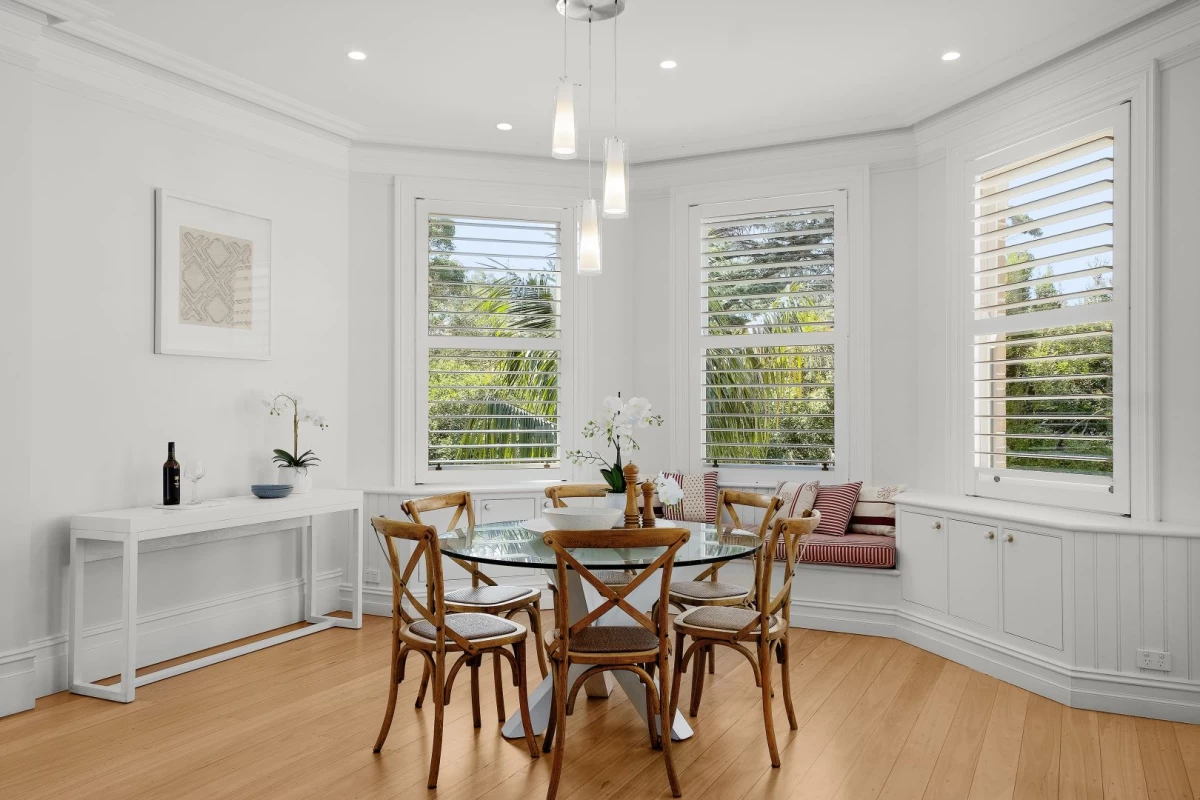 Bright dining room with large windows and a built-in seating nook - 248 Longueville Road, Lane Cove, NSW 2066