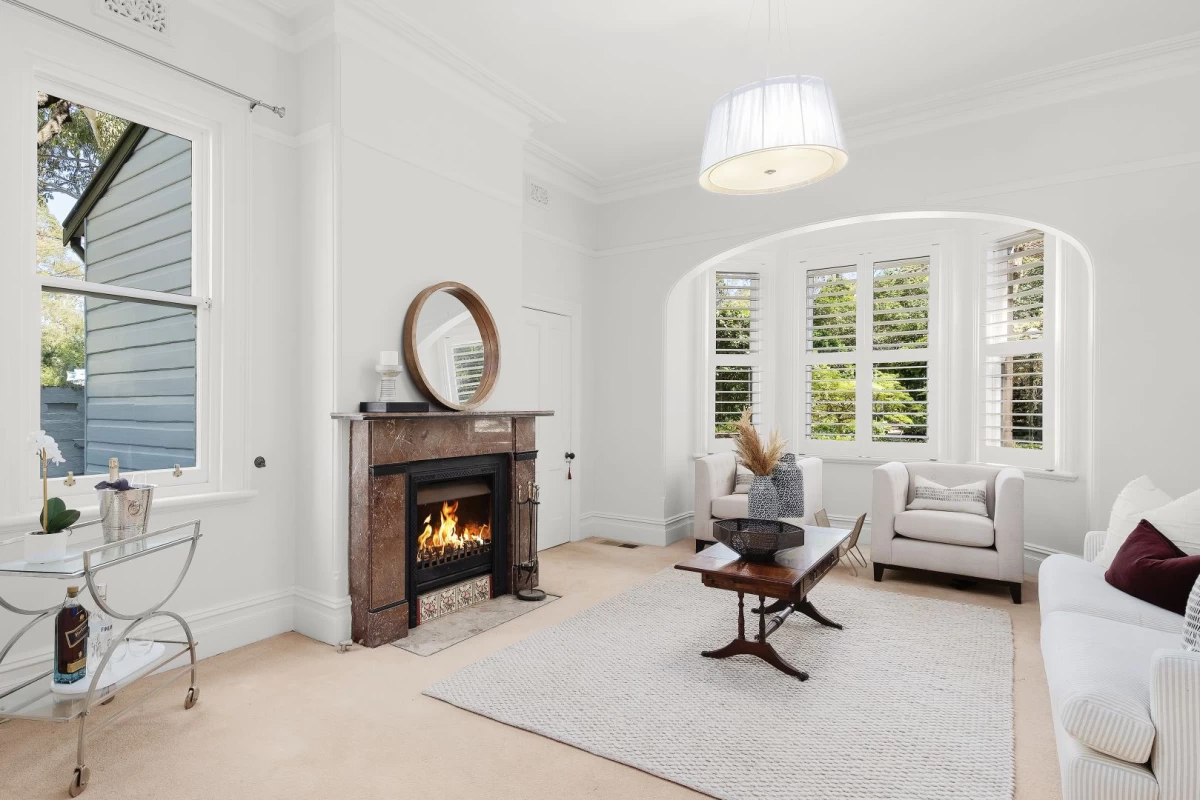 Large living room with a cosy fireplace and big windows - 248 Longueville Road, Lane Cove, NSW 2066