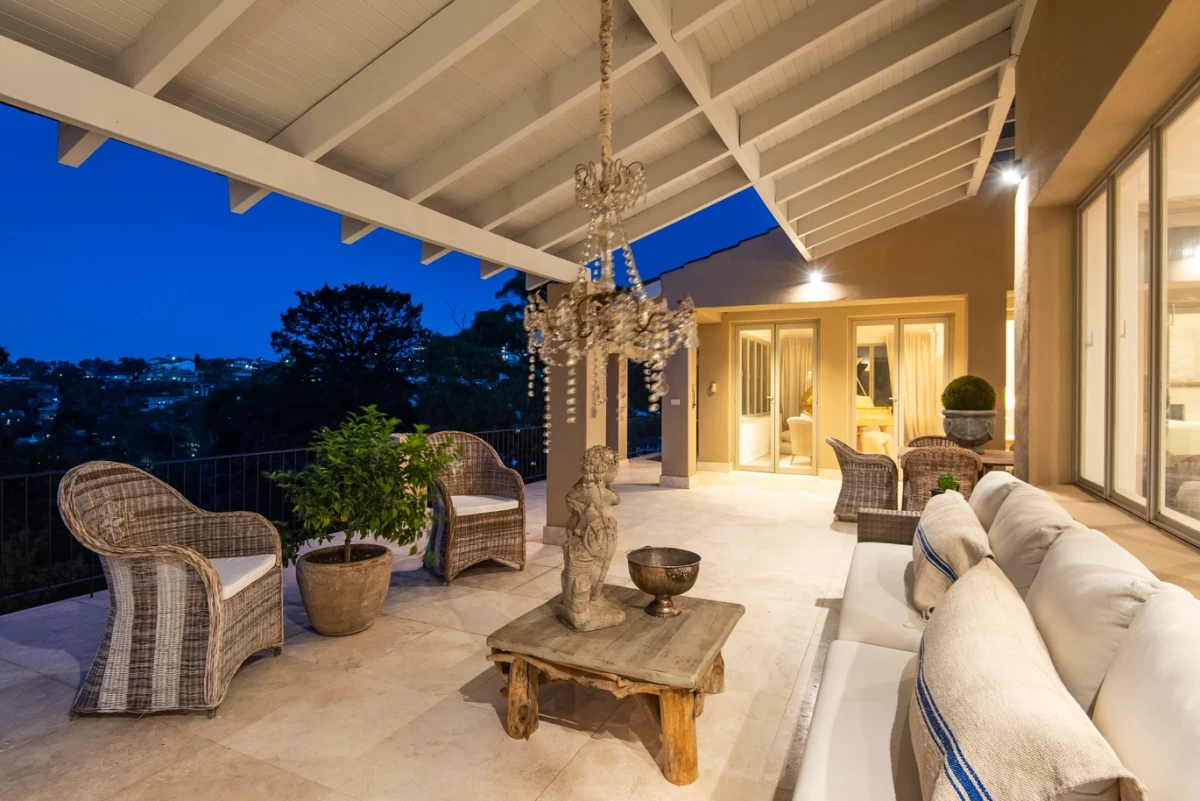 Covered outdoor lounge with seating and a charming chandelier - 25 Wyong Road, Mosman, NSW 2088