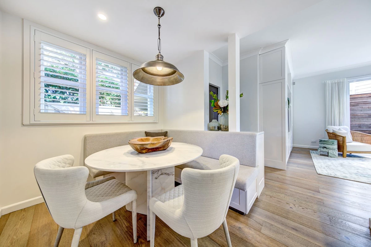 Cosy dining area with built-in bench and round table - 28 Upper Avenue Road, Mosman, NSW 2088