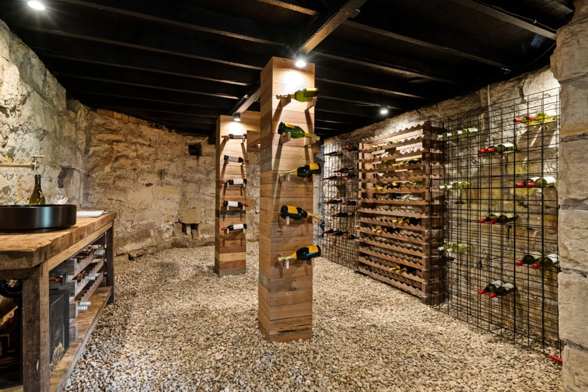 Stone-walled wine cellar with bottle racks and gravel flooring - 3 Little Street, Mosman, NSW 2088