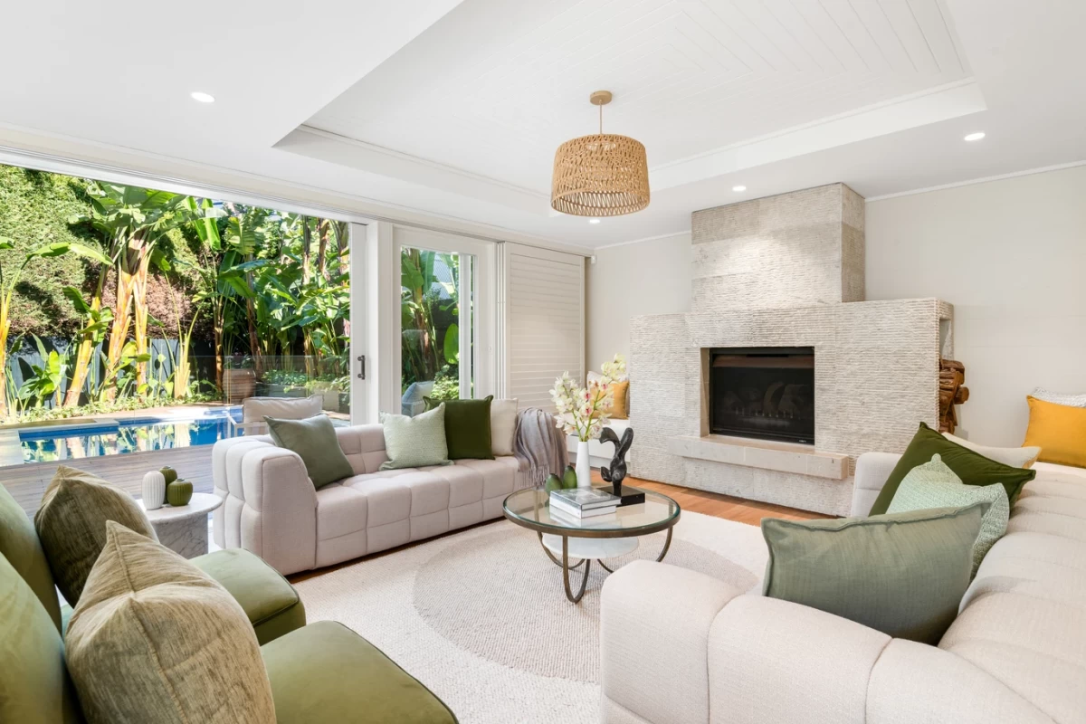 Bright and welcoming family room with a fireplace and garden view - 30 Lower Almora Street, Mosman, NSW 2088