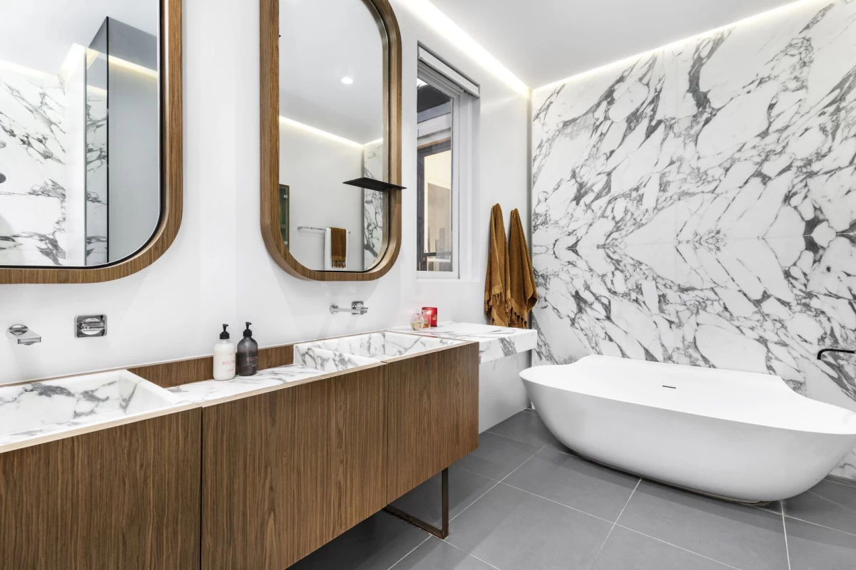 Modern bathroom with double sinks and a big bathtub - 31 Stanley Avenue, Mosman, NSW 2088