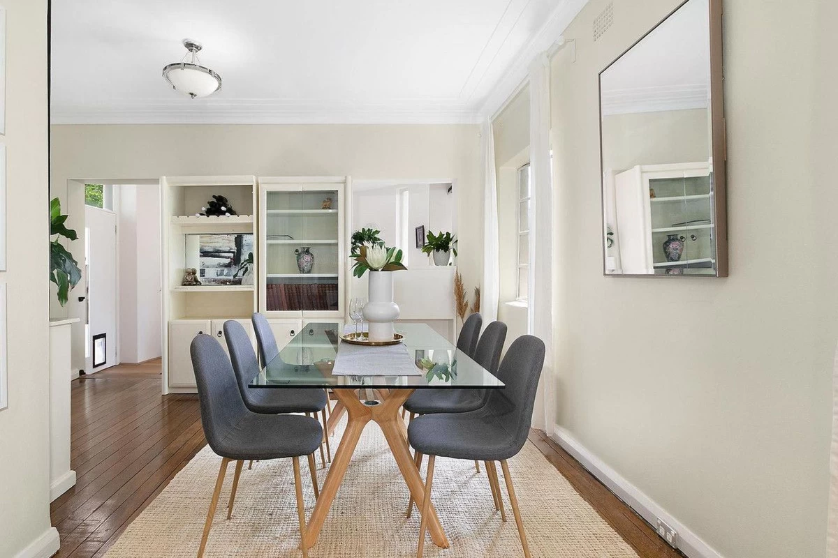 Snug dining room with built-in shelving and bright windows - 32 Phoenix Street, Lane Cove, NSW 2066