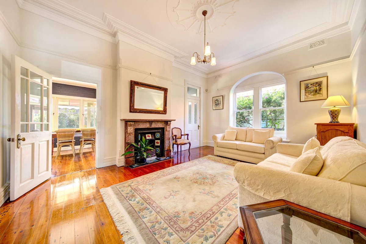 Large living room with wooden floor, fireplace, and big window - 39 Cabramatta Road, Mosman, NSW 2088