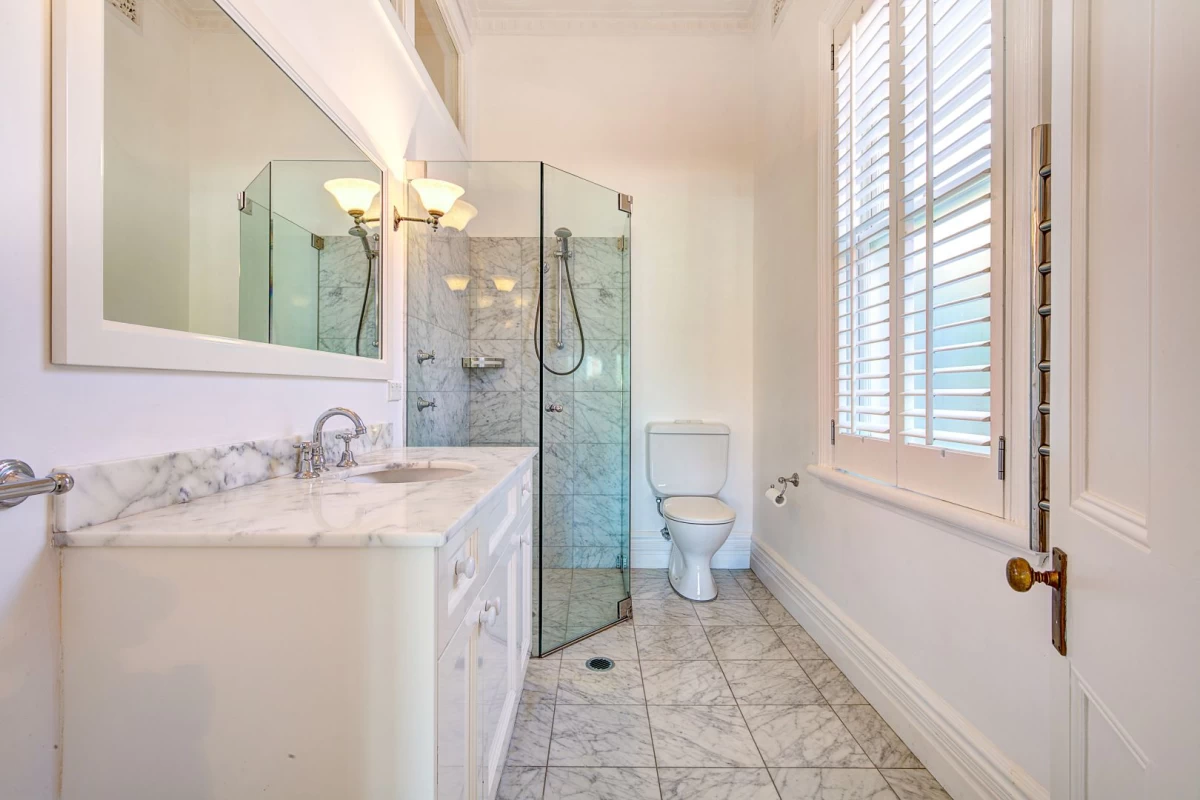 Elegant bathroom with marble surfaces and a glass-doored shower - 39 Cabramatta Road, Mosman, NSW 2088