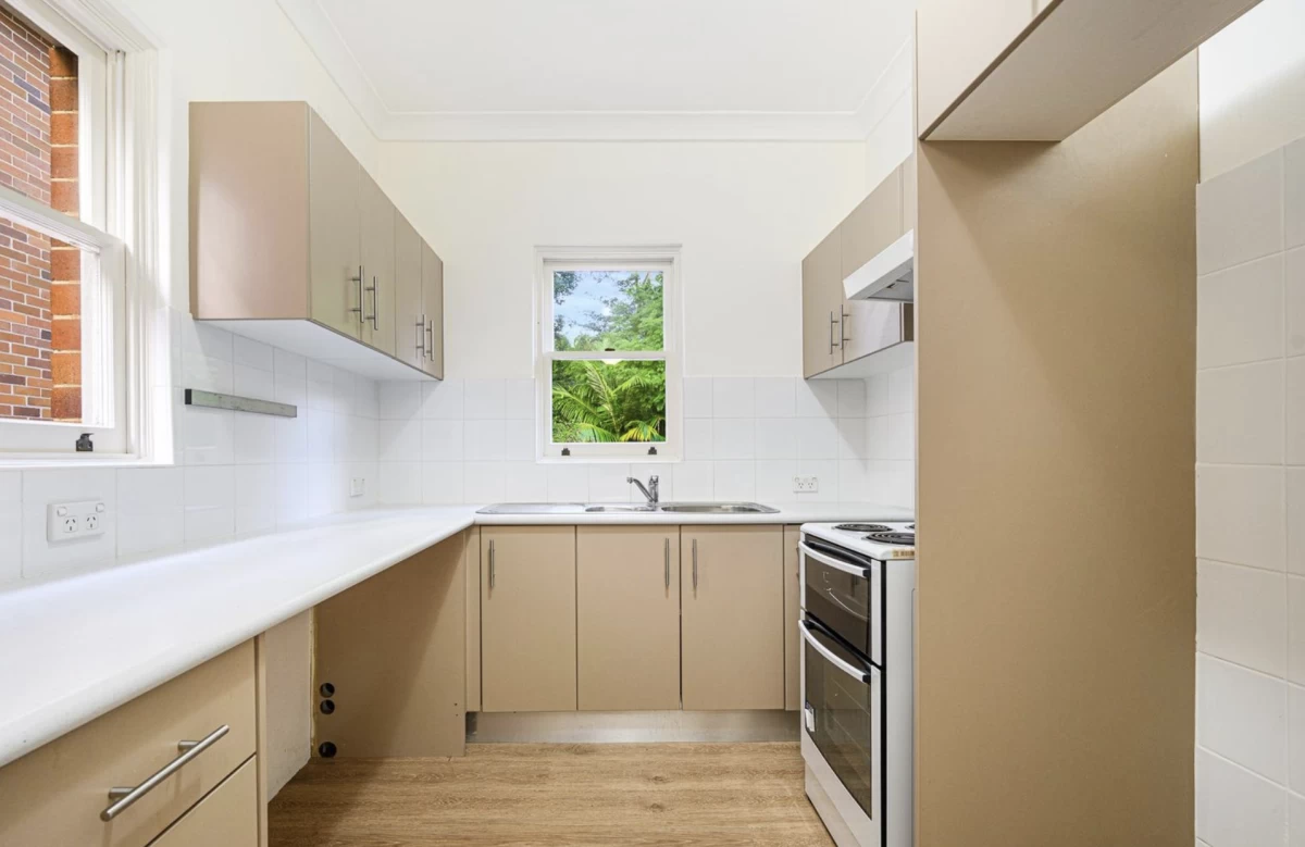 Modern kitchen with plenty of cupboard space and a view outside - 4 Morrice Street, Lane Cove, NSW 2066