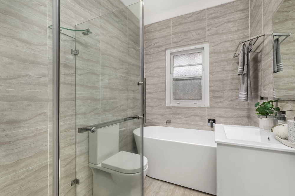 Modern bathroom with a shower, bathtub, toilet, and vanity - 45 Bridge Street, Lane Cove, NSW 2066