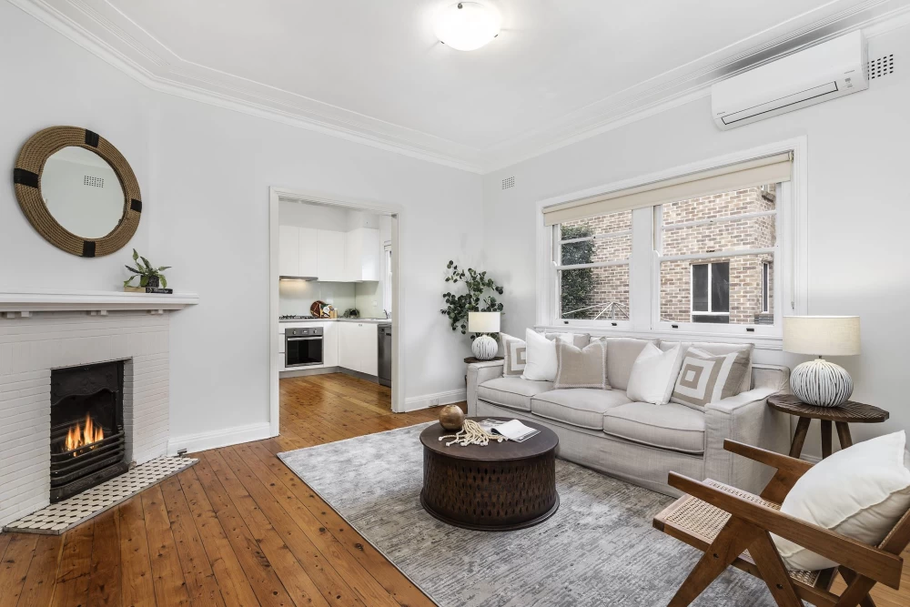 Bright living room with large windows, fireplace, and air conditioning - 45 Bridge Street, Lane Cove, NSW 2066