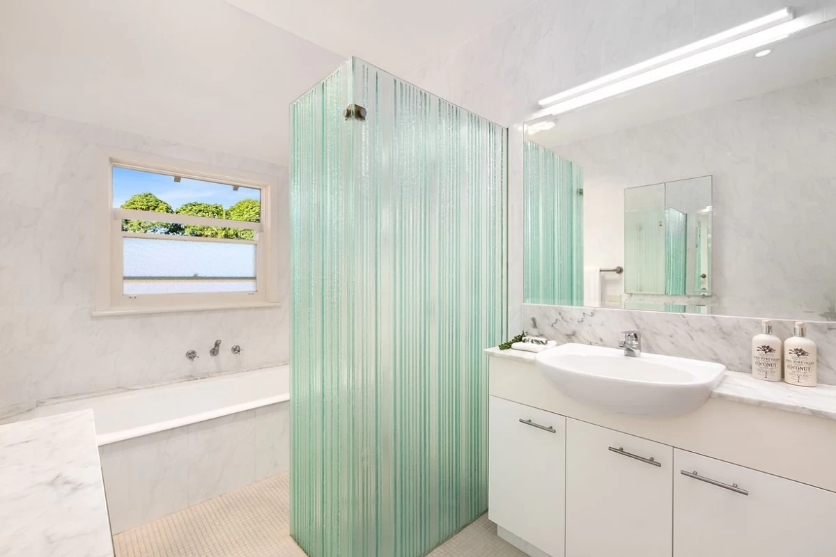 Practical bathroom with a bathtub, shower, and ample storage space - 47 Kimberley Avenue, Lane Cove, NSW 2066