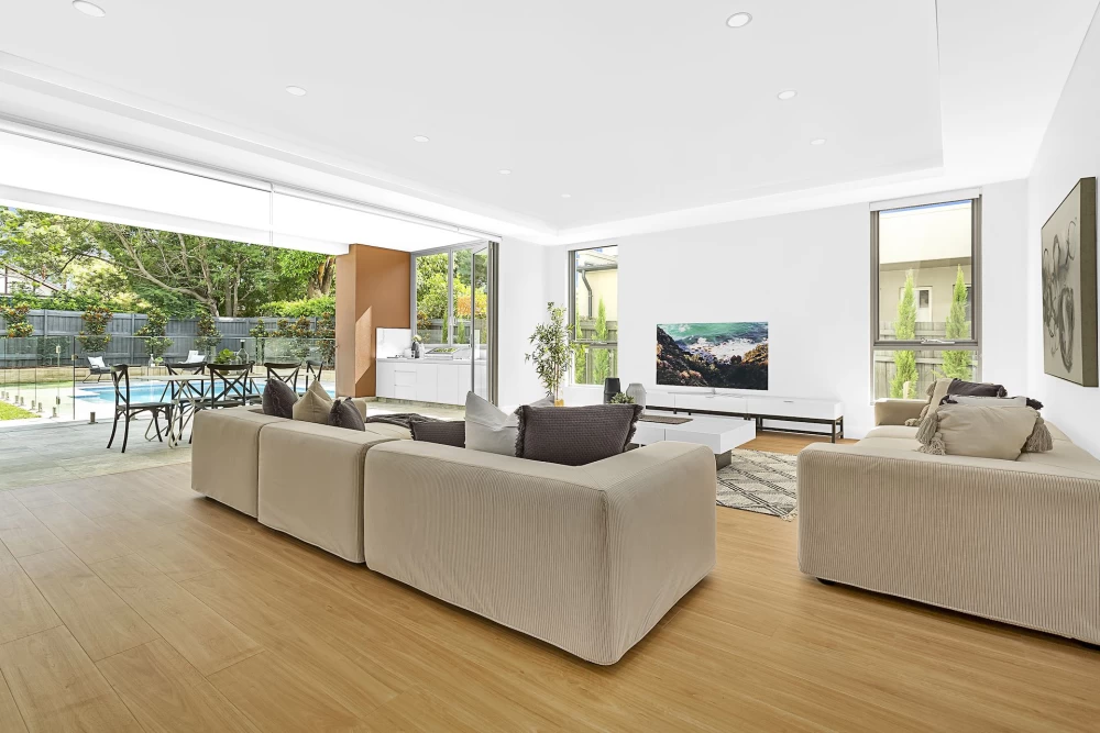 Spacious living room with a TV and glass doors to the outside - 5 Cope Street, Lane Cove, NSW 2066