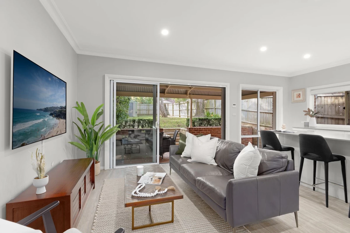 A bright living room with direct access to an outdoor patio - 67 Hallam Avenue, Lane Cove, NSW 2066