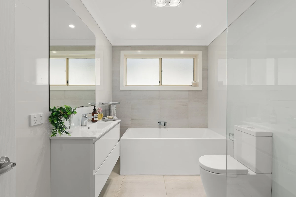 A modern bathroom with a large bathtub and spacious shower area - 67 Hallam Avenue, Lane Cove, NSW 2066