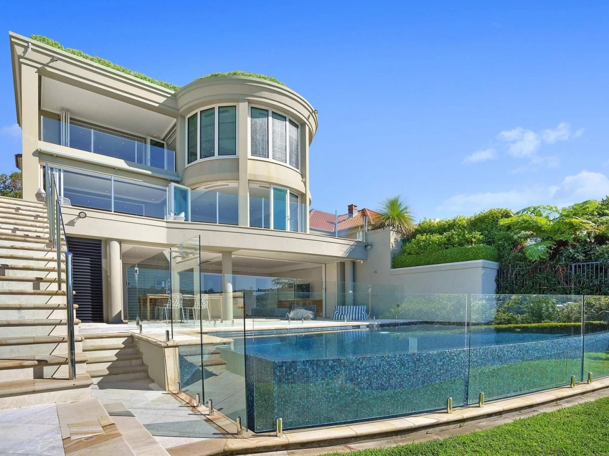 Exterior of a multi-level house with large windows and a backyard swimming pool - 8 Burran Avenue, Mosman, NSW 2088