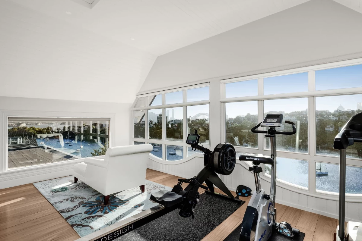 Bright room with gym equipment and views of water and greenery - 9 Musgrave Street, Mosman, NSW 2088