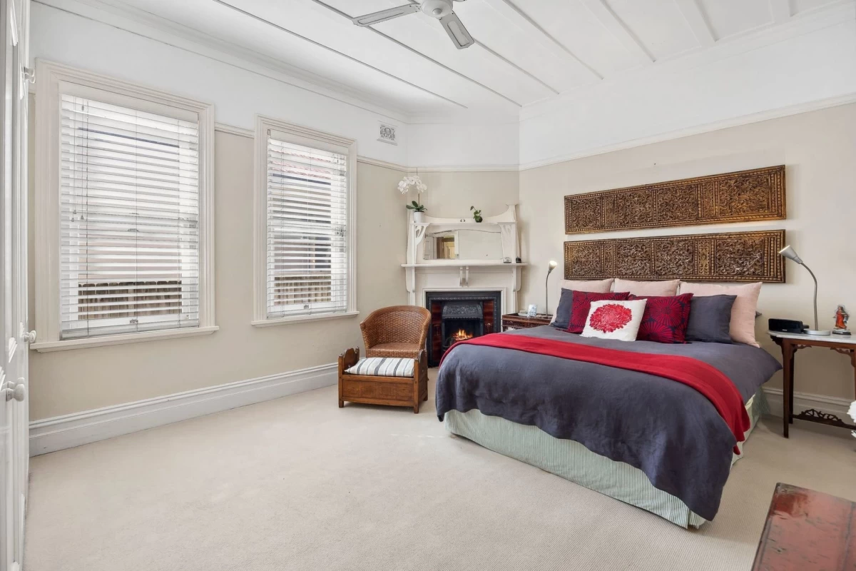 Spacious master bedroom with three windows and a classic fireplace - 98 Raglan Street, Mosman, NSW 2088